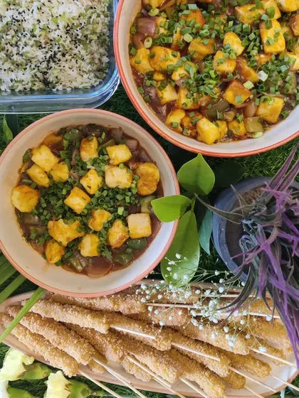 Here is a look at a complete Asian meal we catered. It features our popular crispy baby corn skewers, savoury tofu in black bean sauce, and a side of ginger capsicum fried rice, perfect for a family dinner or small party.
