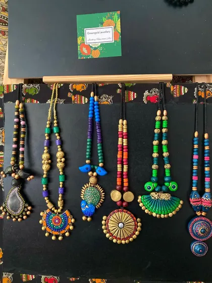 More of my terracotta beauties, showcasing a range of styles from simple round pendants to more elaborate, multi-beaded designs.