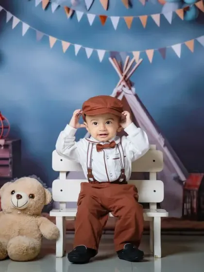 Dressed to impress for his first birthday. This little man looks dapper in his suspenders and bow tie, ready for his cake smash.