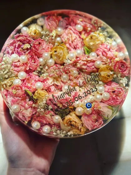 A top-down view of the completed 7-inch circular keepsake. The arrangement is full and lush, ensuring that the beauty of the original varmala is captured from every angle.