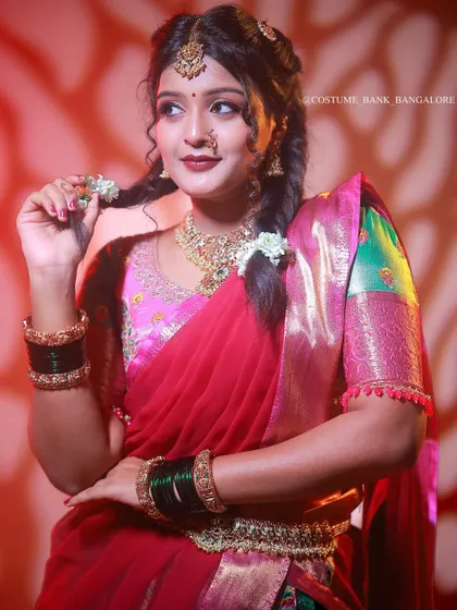 A beautiful portrait of a model in a traditional half-saree, perfect for festivals like Diwali or Navratri.
