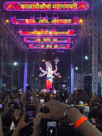 The scale of my productions is designed to handle the largest crowds in Maharashtra. This view of the Kalachowkicha Mahaganpati procession shows how my multi-layered truss and LED banner setup creates a stunning visual frame for the idol, visible to everyone.
