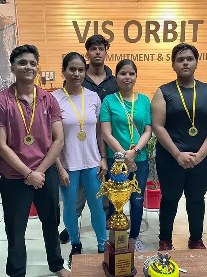 Our female champions posing with their medals and the team trophy. I am incredibly proud to coach and train alongside these strong women.