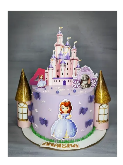 A grand Sofia the First castle cake for a 4th birthday. This fresh pineapple cake features a large castle topper and golden turrets, creating a fairytale scene.