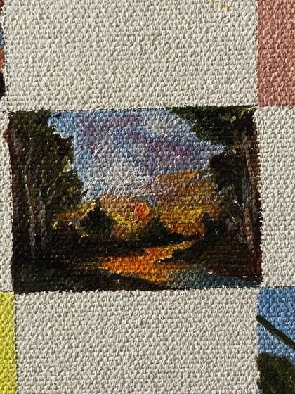 A mini-painting of a sunset through the trees.