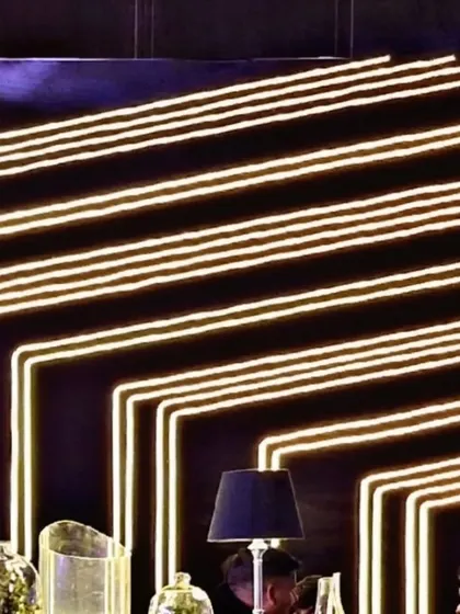 Lighting is our secret sauce. This custom neon-style light installation served as a dynamic backdrop for the bar, adding energy and a cool, modern vibe to the party.