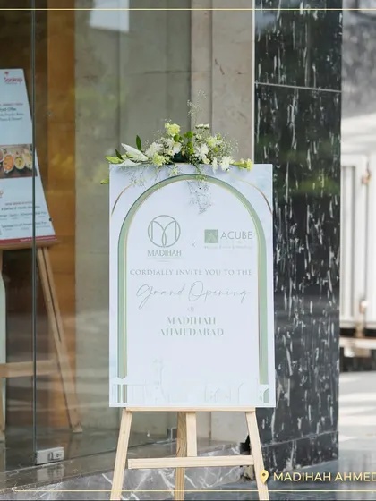 The grand opening sign for Madihah Ahmedabad. I am excited to become a part of the city's celebrations and help create lasting memories.