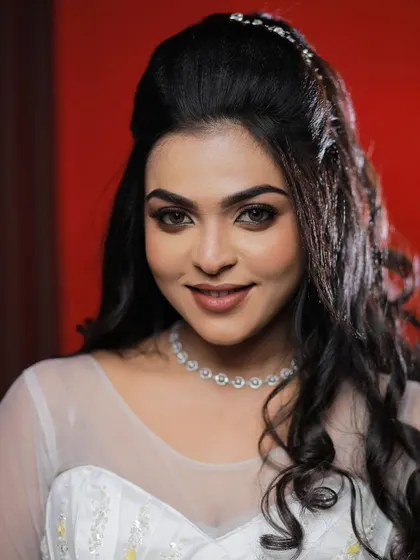 A close-up of a model's face, showing off a glamorous and elegant Christian wedding makeup look.