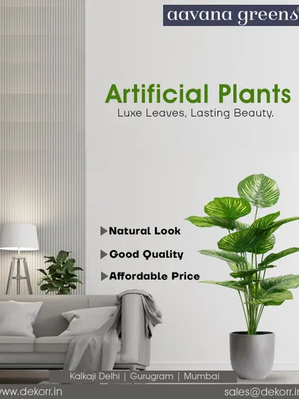 Luxe leaves, lasting beauty. This artificial Calathea plant adds a touch of sophistication to this living room, showcasing how our plants can complement any decor style.