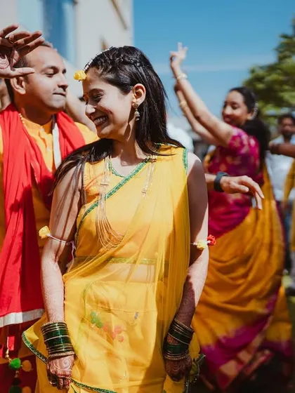 The couple dancing together during their Haldi, a perfect blend of tradition and fun.