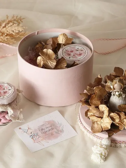 Celebrating a little one's arrival with our pink-themed baby announcement hampers. This one features our popular rose almonds and brownie bites.