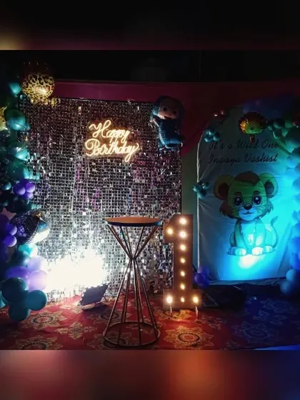 This view highlights the custom-printed backdrop and light-up number '1' that make this jungle theme extra special.