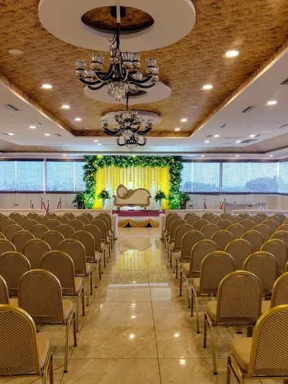 Another view of the venue with the yellow floral stage.