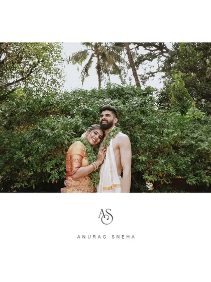 A romantic portrait of a couple in a lush green setting, personalized with their initials.