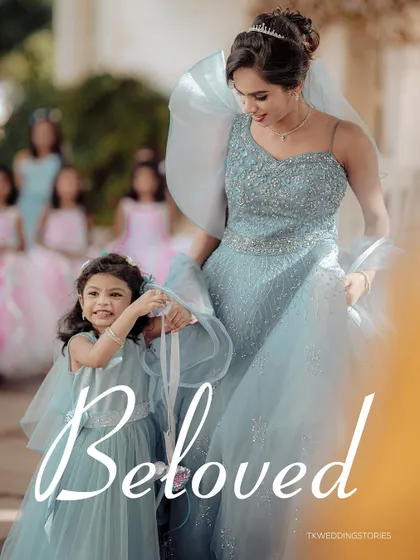 A duplicate of image 130, capturing the sweet connection between the bride and her little attendant.