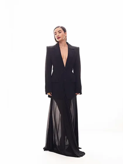 A masterclass in high-fashion power dressing. We paired a strong-shouldered Balenciaga blazer with a delicate sheer skirt for Patralekhaa for a look that is pure editorial.