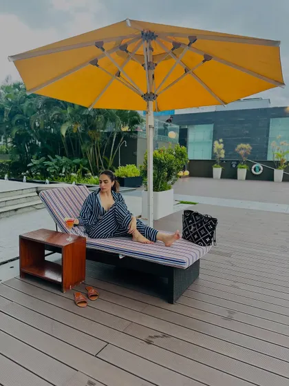A wider shot of the poolside scene, showing how the co-ord fits into the relaxed, vacation vibe.