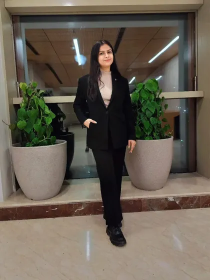 A full-length professional portrait. My attire reflects my respect for the profession and the institutions I am a part of.