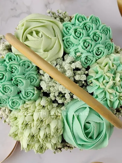 This monochromatic green cupcake bouquet shows how I can customize colors to fit a specific theme. The different shades and piping styles create a sophisticated and unique look.
