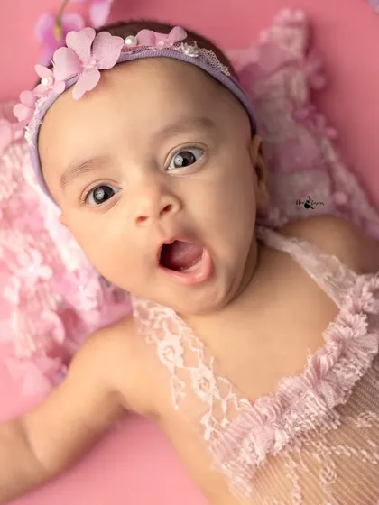 A tiny yawn from our little flower fairy! These spontaneous, unposed moments are often the most heartwarming and authentic captures from a newborn session.