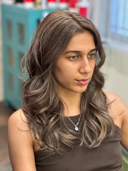 A portrait of the client, her new hair color looking natural and beautiful.