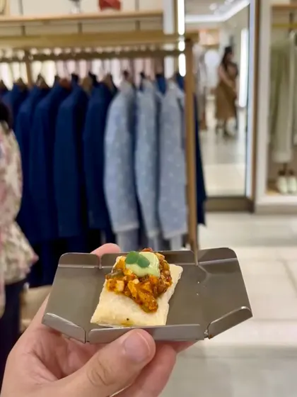 A hand-held appetizer of paneer tikka on a flaky pastry, served at the chic Tasva store launch.
