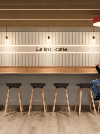 "But first, coffee." This detail shot from our cafeteria concept shows a dedicated coffee bar with sleek stools, designed as a quick pit-stop for refreshment and casual conversation.