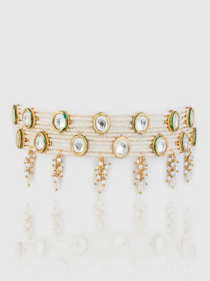 A wider version of our kundan and pearl choker, featuring two rows of pearls for a more dramatic statement.