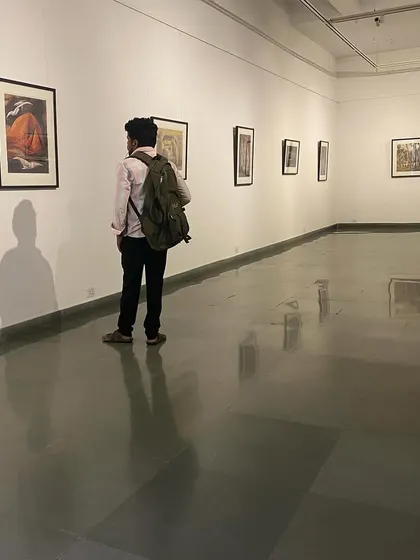 A visitor contemplating a work at the Jehangir Sabavala exhibition.