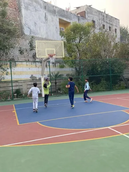 Players move around the court during a scrimmage.