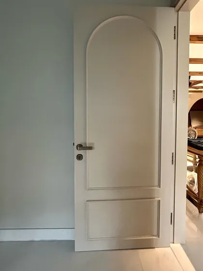 A classic arched door, freshly painted and ready for installation. We love using architectural elements like this to add character and timeless appeal.
