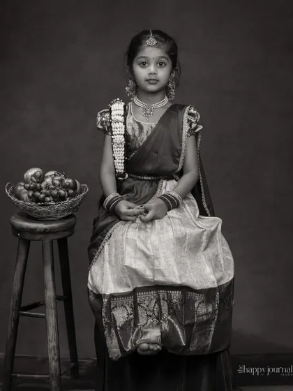 A black and white version of the traditional portrait, which adds a timeless and classic feel to the girl's graceful pose.