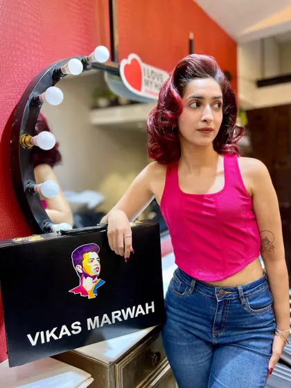 A proud moment with a happy client and her new red hair. She's posing with my custom case, fully embracing her bold new style.