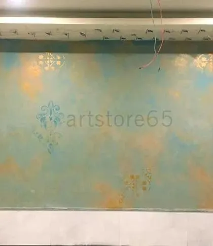 For this restaurant project, we started with a blended texture of blue, orange, and gold. We then layered subtle traditional motifs using stencils to add detail and thematic elements to the space.