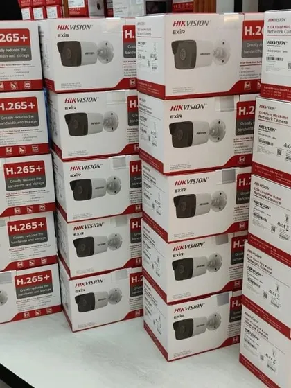 Stacks of Hikvision EXIR network cameras, both dome and bullet types.