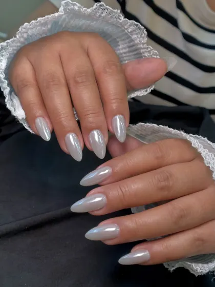 The pearly chrome finish looks so elegant against the client's delicate lace sleeve. It's a versatile look that can be dressed up or down.