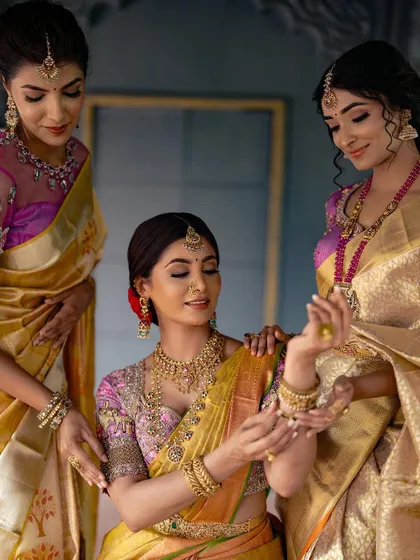 A duplicate of image 61, showcasing the beauty of traditional attire and the bond between a bride and her friends.