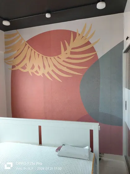 An abstract geometric mural with a sunset color palette. This modern design adds a contemporary and artistic feel to this bedroom wall.