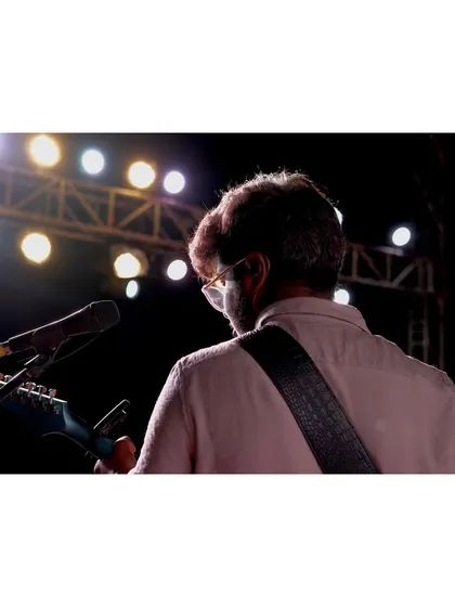 A view from behind our guitarist at the Gangavathi wedding show. The stage was set beautifully, and the energy was electric.