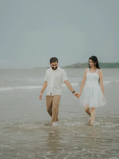 A simple walk, hand in hand, through the shallow waters. This candid shot of Pragati and Swapnil shows the easy comfort of their relationship.