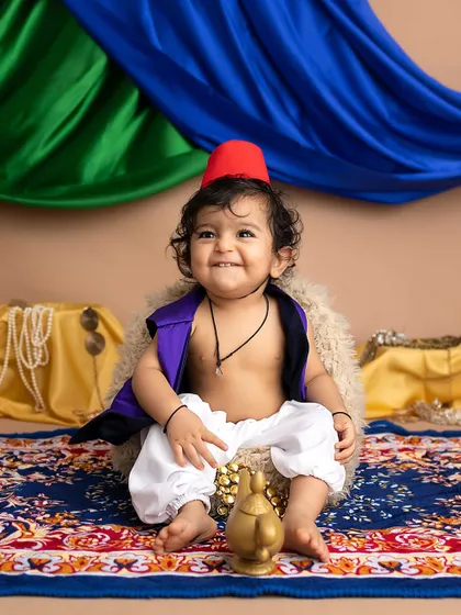 A joyful smile from our little street rat. The Aladdin theme is one of my most popular and fun setups for baby boys.