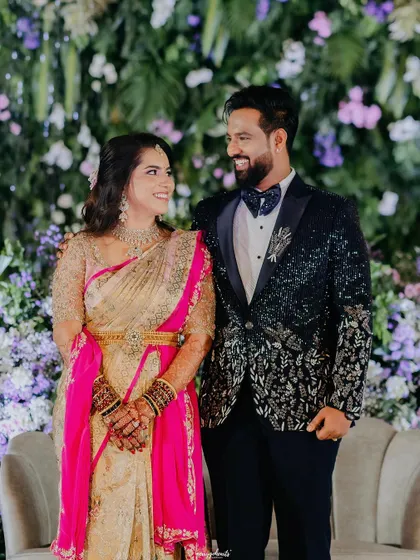 A lovely photo against a floral backdrop. The bride's makeup is fresh and glamorous, perfect for her reception.
