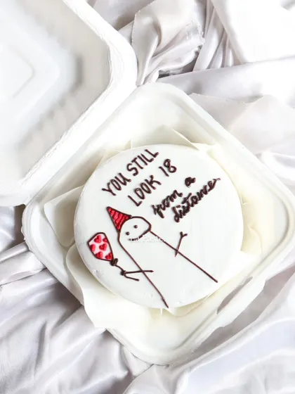 I love making these fun and quirky bento cakes! This one has a funny meme design that's perfect for a friend with a great sense of humor. It's a small cake that brings a big smile.