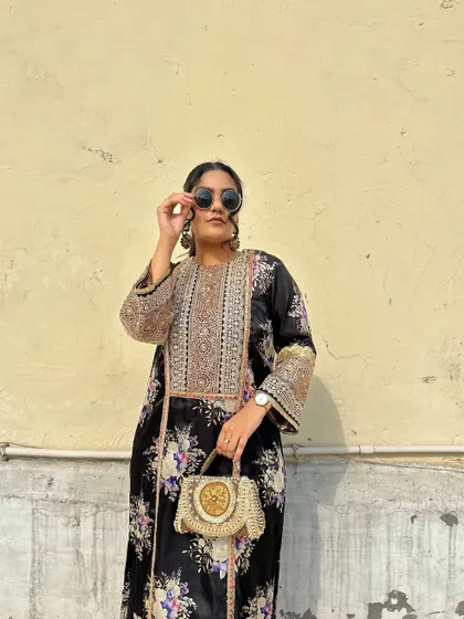 Styling the floral kurta with oversized sunglasses for a chic, contemporary feel.