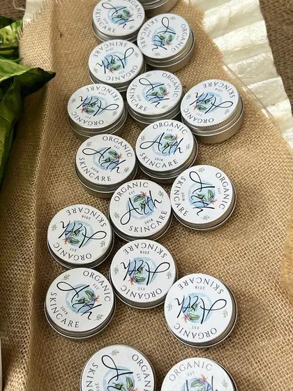 A close-up of my travel-sized moisturizers, neatly arranged at a pop-up event. These are perfect for trying out a new product or for taking your favorite skincare on the go.