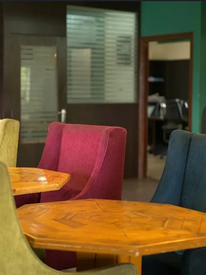 Work doesn't have to be confined to four walls. My space offers colorful, comfortable seating and a view into our private meeting rooms, making your workday more dynamic.