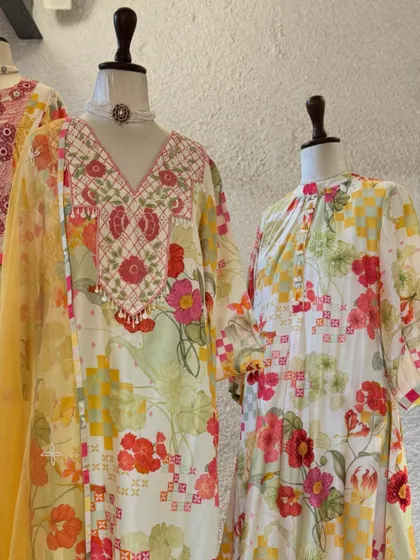 Festive florals for the celebrations ahead. This display features beautiful printed suits with delicate embroidery on the neckline.