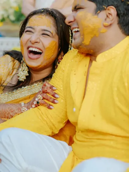 A moment of pure laughter and joy between the bride and groom during their playful Haldi ceremony in Rajasthan.