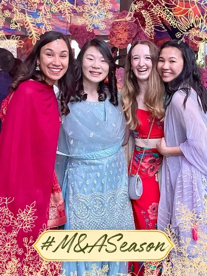 A beautiful moment of friendship between guests from around the world, captured at an Indian wedding with our custom photo frame.