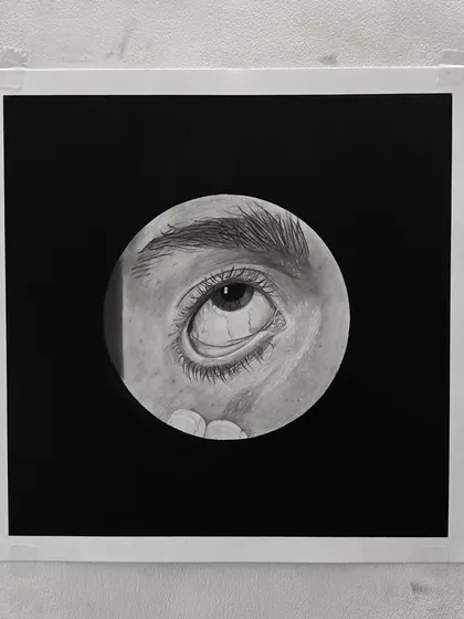 The framed version of one of my hyper-realistic eye drawings. The black background makes the details pop.